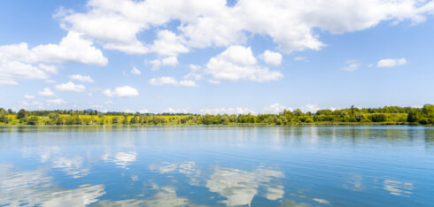 Scenic view of clouds reflecting in lake.