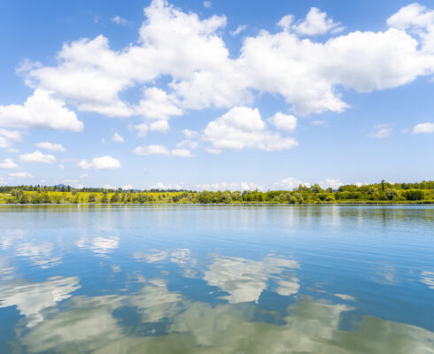 Scenic view of clouds reflecting in lake.