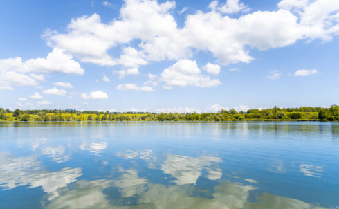 Scenic view of clouds reflecting in lake.