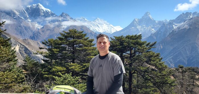 Nava Pokharel with Mount Everest in the background.